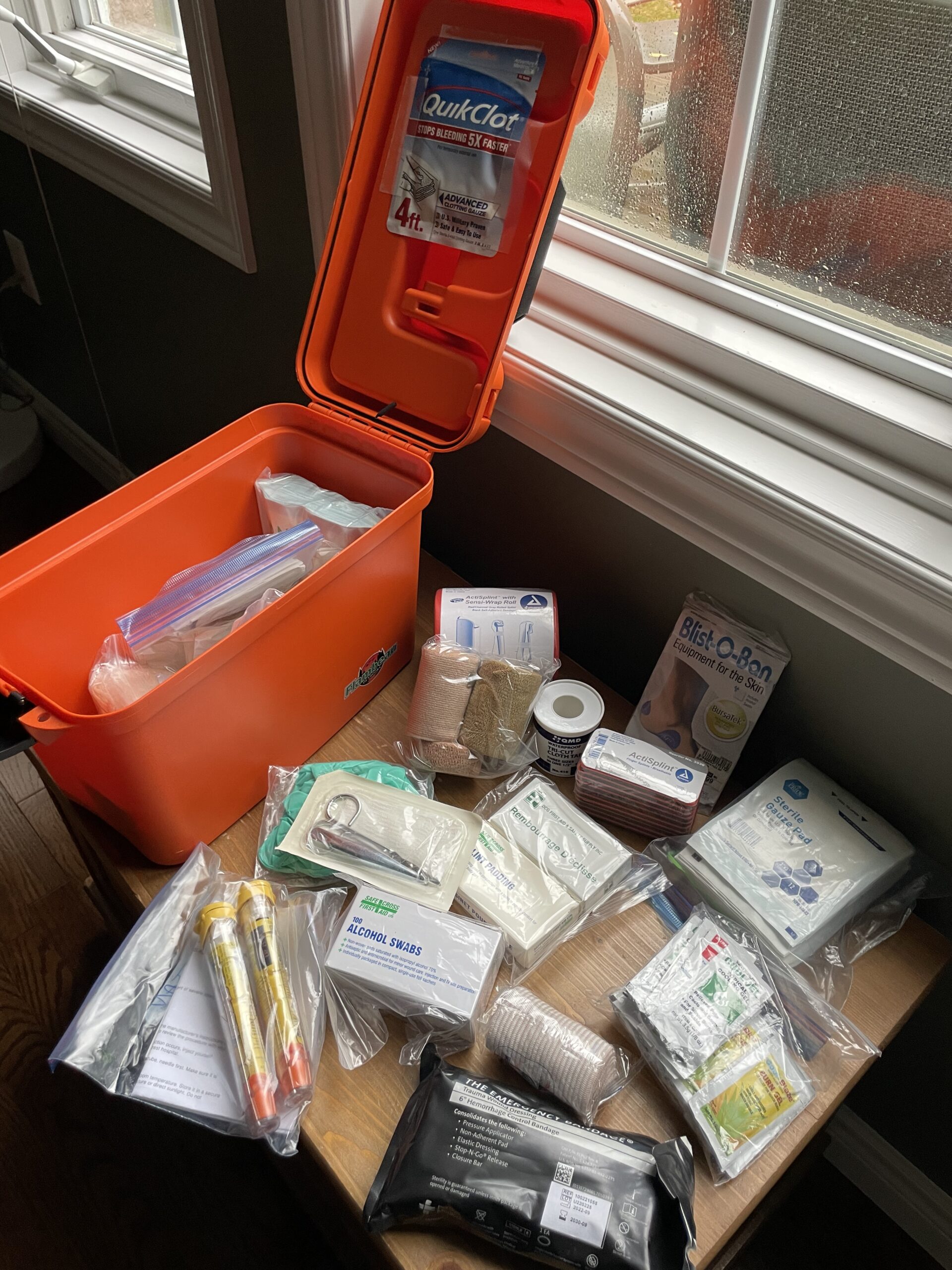 Compact first aid kit packed for hiking and outdoor family travel preparedness.